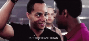 Man with raised hand is instructed to "put your hand down"